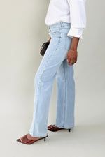 Side view of MODACCIO Livia Jean featuring wide-leg silhouette and long inseam